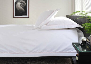 The Belvedere Bed Linen Set in Blush - Dressed Bed - Side View